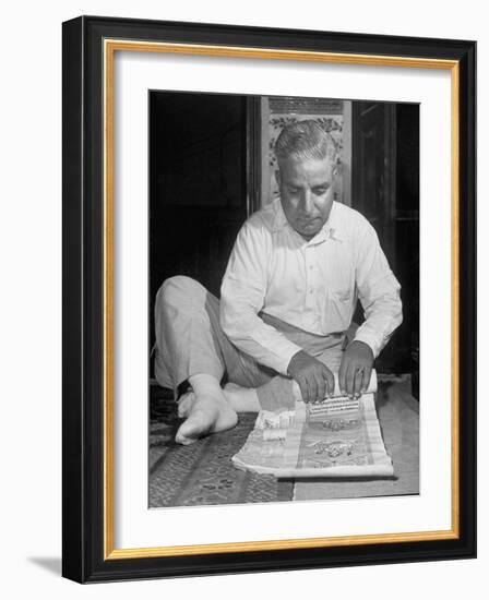 Broker Astrologer Reading Horoscope While Trading at Bombay Stock Exchange-Margaret Bourke-White-Framed Photographic Print