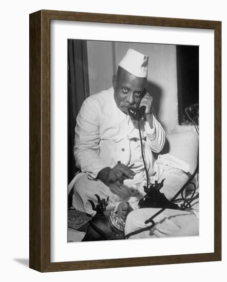 Brokers Speaking on Telephone at Bombay Stock and Cotton Exchanges-Margaret Bourke-White-Framed Photographic Print