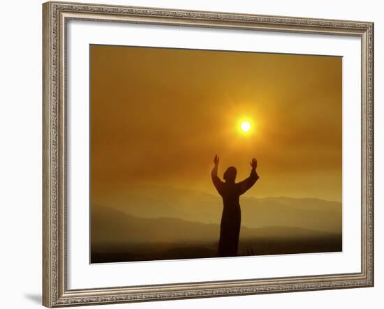 Bronze Statue of Jesus Stands at Cemetery Overlooking a Wildfire Burning in Anaheim Hills Area-null-Framed Photographic Print
