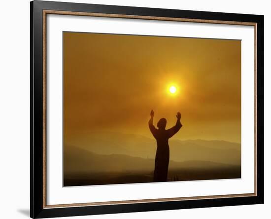 Bronze Statue of Jesus Stands at Cemetery Overlooking a Wildfire Burning in Anaheim Hills Area-null-Framed Photographic Print