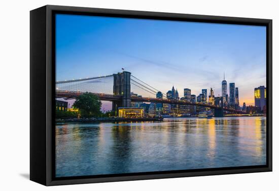 Brooklyn Bridge and Manhattan skyline at dusk, viewed from the East River, New York City, United St-Fraser Hall-Framed Premier Image Canvas