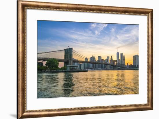 Brooklyn Bridge and Manhattan skyline at dusk, viewed from the East River, New York City, United St-Fraser Hall-Framed Photographic Print