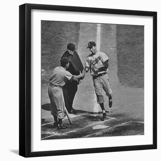 Brooklyn Dodger Carl Furillo Greeted by Batboy at Home Plate, World Series, Yankee Stadium-Ralph Morse-Framed Premium Photographic Print