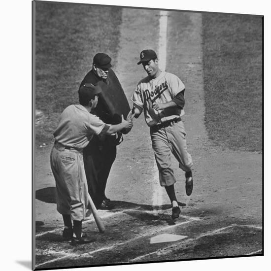 Brooklyn Dodger Carl Furillo Greeted by Batboy at Home Plate, World Series, Yankee Stadium-Ralph Morse-Mounted Premium Photographic Print