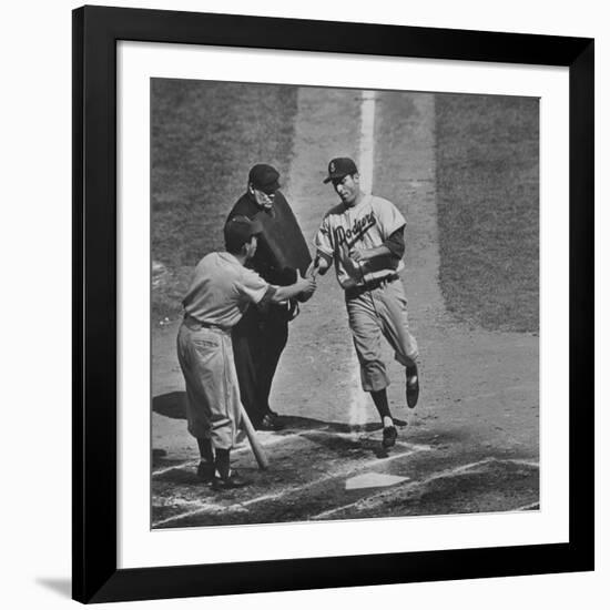 Brooklyn Dodger Carl Furillo Greeted by Batboy at Home Plate, World Series, Yankee Stadium-Ralph Morse-Framed Premium Photographic Print