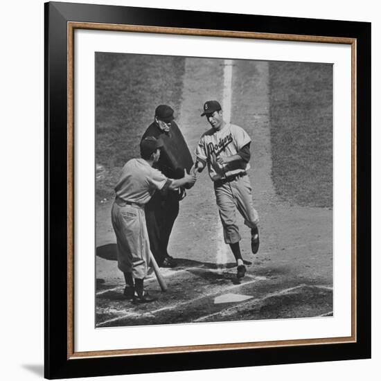 Brooklyn Dodger Carl Furillo Greeted by Batboy at Home Plate, World Series, Yankee Stadium-Ralph Morse-Framed Premium Photographic Print