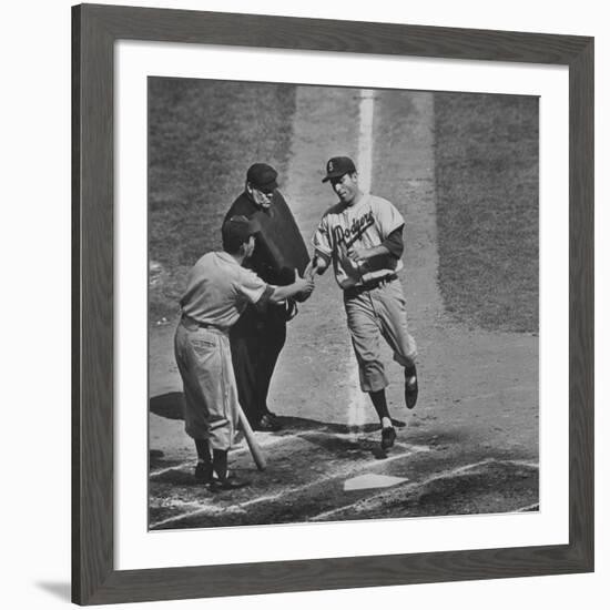 Brooklyn Dodger Carl Furillo Greeted by Batboy at Home Plate, World Series, Yankee Stadium-Ralph Morse-Framed Premium Photographic Print