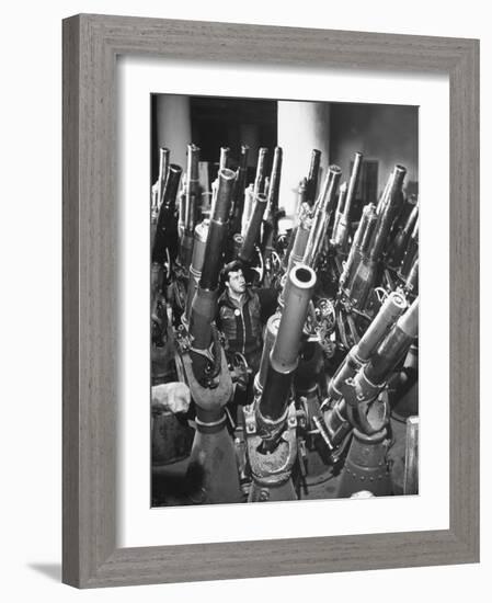 Brooklyn Naval Yard Worker Looking over a Storage of Guns-George Strock-Framed Photographic Print