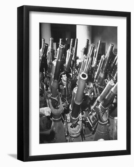 Brooklyn Naval Yard Worker Looking over a Storage of Guns-George Strock-Framed Photographic Print