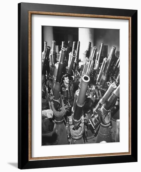 Brooklyn Naval Yard Worker Looking over a Storage of Guns-George Strock-Framed Photographic Print