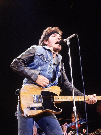 Bruce Springsteen Playing Guitar While Performing on Stage ...