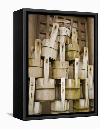 Buckets Stacked at Yasaka Shrine in Kyoto-Rudy Sulgan-Framed Premier Image Canvas