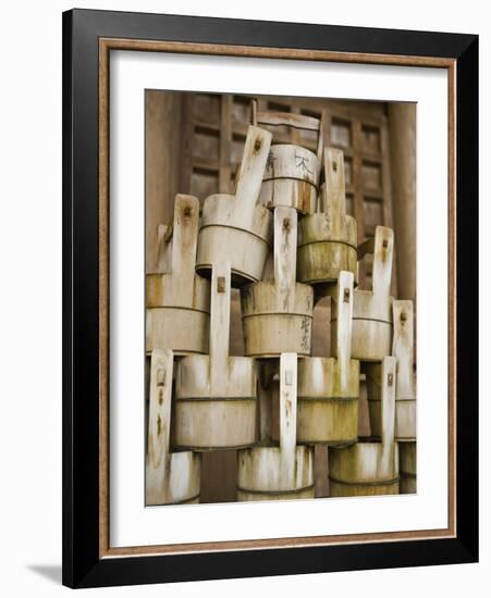 Buckets Stacked at Yasaka Shrine in Kyoto-Rudy Sulgan-Framed Photographic Print