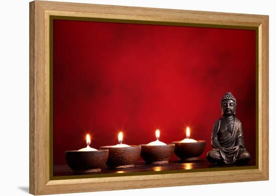 Buddha and Candles on Red Background, Religious Concept.-Sofiaworld-Framed Premier Image Canvas