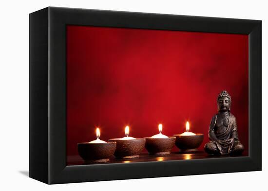 Buddha and Candles on Red Background, Religious Concept.-Sofiaworld-Framed Premier Image Canvas