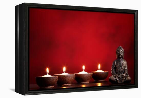 Buddha and Candles on Red Background, Religious Concept.-Sofiaworld-Framed Premier Image Canvas