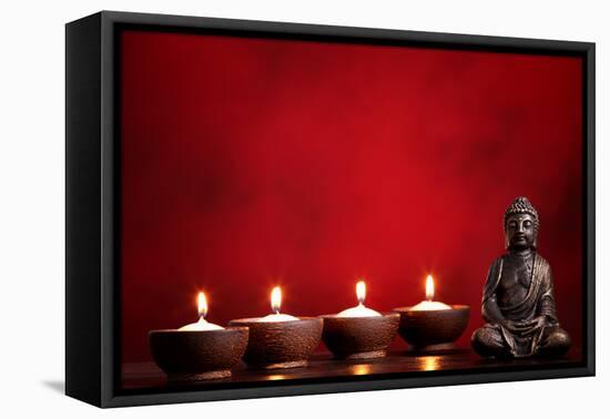 Buddha and Candles on Red Background, Religious Concept.-Sofiaworld-Framed Premier Image Canvas