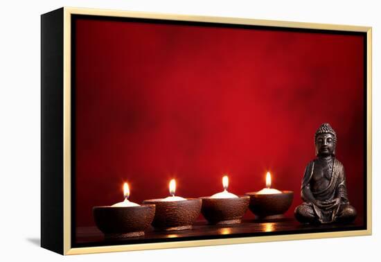 Buddha and Candles on Red Background, Religious Concept.-Sofiaworld-Framed Premier Image Canvas
