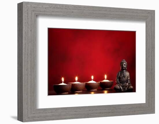 Buddha and Candles on Red Background, Religious Concept.-Sofiaworld-Framed Photographic Print