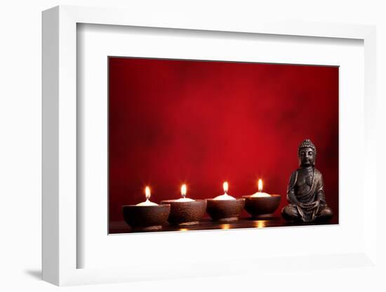 Buddha and Candles on Red Background, Religious Concept.-Sofiaworld-Framed Photographic Print