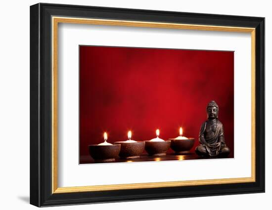 Buddha and Candles on Red Background, Religious Concept.-Sofiaworld-Framed Photographic Print