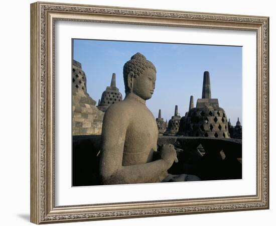Buddha Image Sitting in Open Chamber with Stupas in Background, Borobudur Temple, Indonesia-Jane Sweeney-Framed Photographic Print