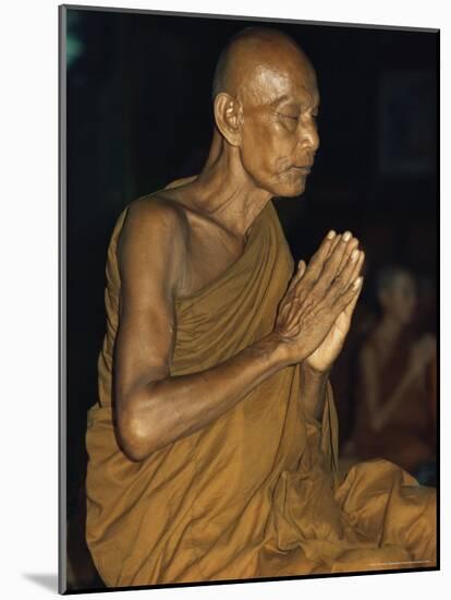 Buddhist Monk Meditating, Wat Suntorn, Bangkok, Thailand, Southeast Asia-John Henry Claude Wilson-Mounted Photographic Print