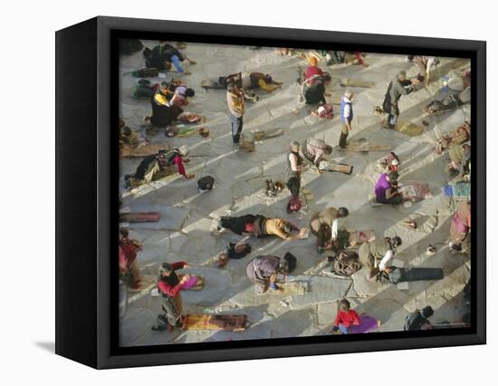 Buddhist Pilgrims Prostrating, Barkhor Jokhang Temple, Lhasa, Tibet, China-Gavin Hellier-Framed Premier Image Canvas