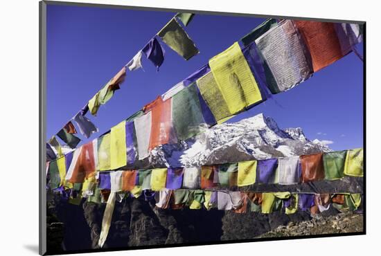 Buddhist Prayer Flags with Mount Kongde Ri Behind Taken Just Above the Town of Namche Bazaar-John Woodworth-Mounted Photographic Print