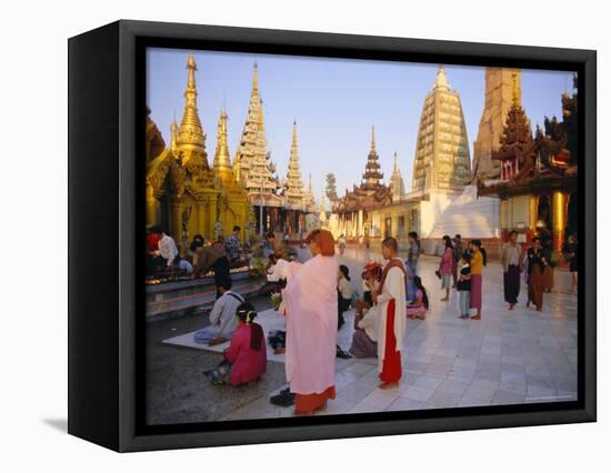 Buddhist Worshippers at the Shwedagon Paya (Shwe Dagon Pagoda), Yangon (Rangoon), Myanmar (Burma)-Christina Gascoigne-Framed Premier Image Canvas