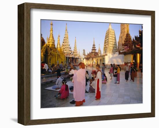 Buddhist Worshippers at the Shwedagon Paya (Shwe Dagon Pagoda), Yangon (Rangoon), Myanmar (Burma)-Christina Gascoigne-Framed Photographic Print