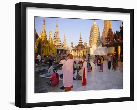 Buddhist Worshippers at the Shwedagon Paya (Shwe Dagon Pagoda), Yangon (Rangoon), Myanmar (Burma)-Christina Gascoigne-Framed Photographic Print