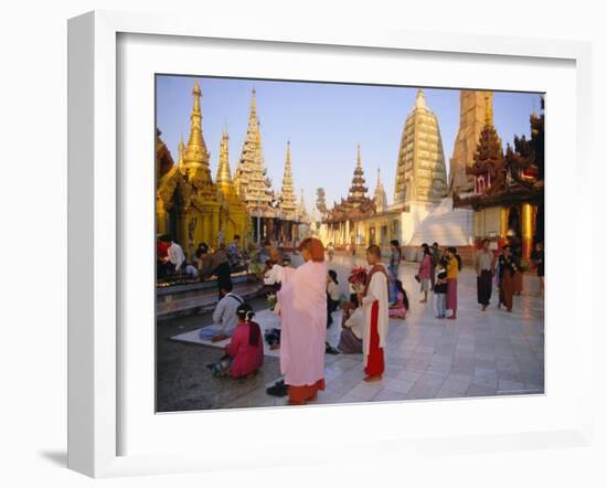 Buddhist Worshippers at the Shwedagon Paya (Shwe Dagon Pagoda), Yangon (Rangoon), Myanmar (Burma)-Christina Gascoigne-Framed Photographic Print