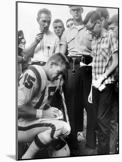 Buffalo Bills Player Jack Kemp Signs His Autograph for a Boy on August 4, 1964-null-Mounted Photo