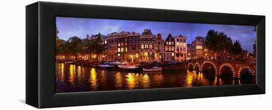 Buildings Along a Canal at Dusk, Amsterdam, Netherlands-null-Framed Stretched Canvas