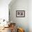 Bulldog Mix Puppy Sleeping on Gray Sofa at Home-Anna Hoychuk-Framed Photographic Print displayed on a wall