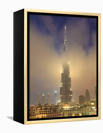 Burj Khalifa Illuminates the Clouds and Surrounding Skyline at Night, Downtown, Dubai, Uae-Amanda Hall-Framed Premier Image Canvas