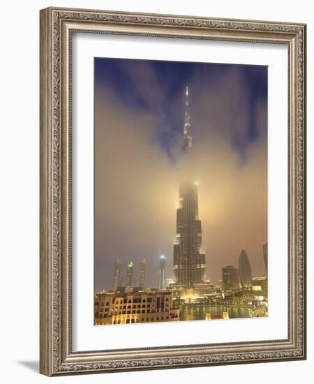 Burj Khalifa Illuminates the Clouds and Surrounding Skyline at Night, Downtown, Dubai, Uae-Amanda Hall-Framed Photographic Print