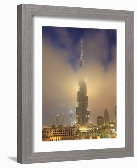 Burj Khalifa Illuminates the Clouds and Surrounding Skyline at Night, Downtown, Dubai, Uae-Amanda Hall-Framed Photographic Print