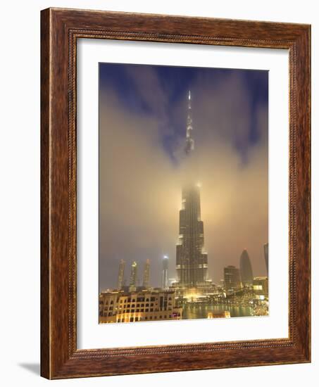 Burj Khalifa Illuminates the Clouds and Surrounding Skyline at Night, Downtown, Dubai, Uae-Amanda Hall-Framed Photographic Print