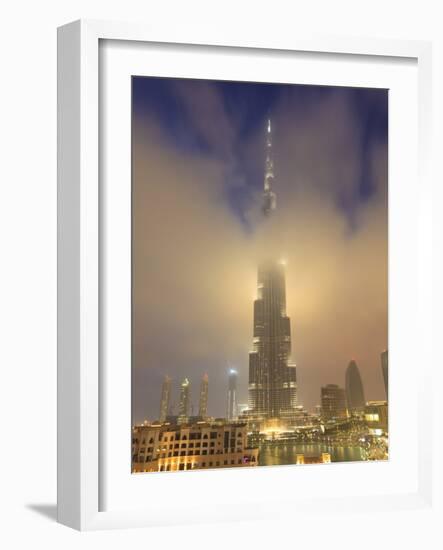 Burj Khalifa Illuminates the Clouds and Surrounding Skyline at Night, Downtown, Dubai, Uae-Amanda Hall-Framed Photographic Print