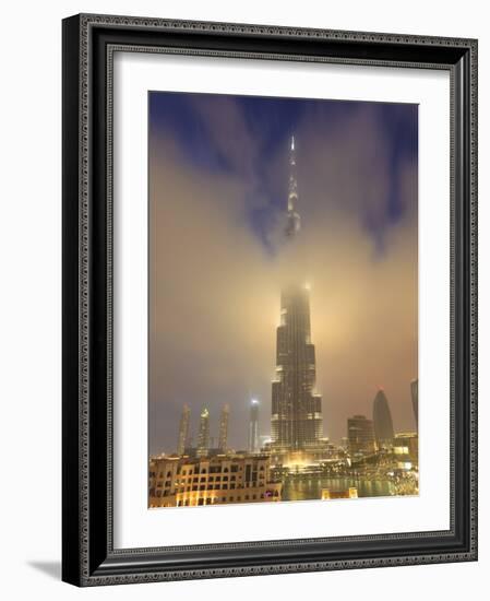 Burj Khalifa Illuminates the Clouds and Surrounding Skyline at Night, Downtown, Dubai, Uae-Amanda Hall-Framed Photographic Print