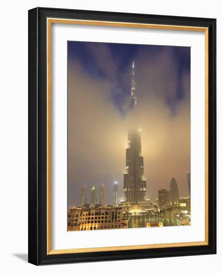 Burj Khalifa Illuminates the Clouds and Surrounding Skyline at Night, Downtown, Dubai, Uae-Amanda Hall-Framed Photographic Print