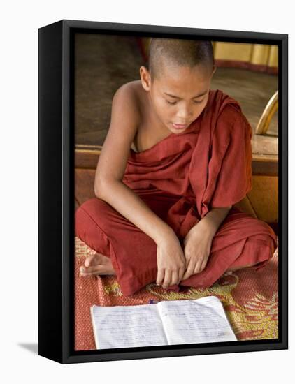 Burma, Lake Inle, A Young Novice Monk Learning at a Monastery School on Lake Inle, Myanmar-Nigel Pavitt-Framed Premier Image Canvas