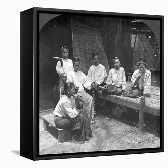 Burmese Women Smoking Outside their Home, Mandalay, Burma, 1908-null-Framed Premier Image Canvas
