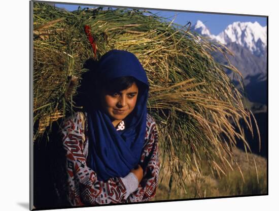 Burusho Girl Returns Home with Fodder for Her Livestock in the Hunza Valley-Amar Grover-Mounted Photographic Print