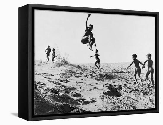 Bushman Children Playing Games on Sand Dunes-Nat Farbman-Framed Premier Image Canvas