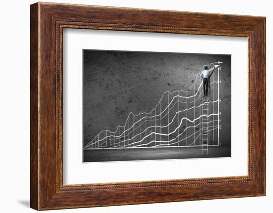 Businessman Drawing Graphics on Wall-Sergey Nivens-Framed Photographic Print