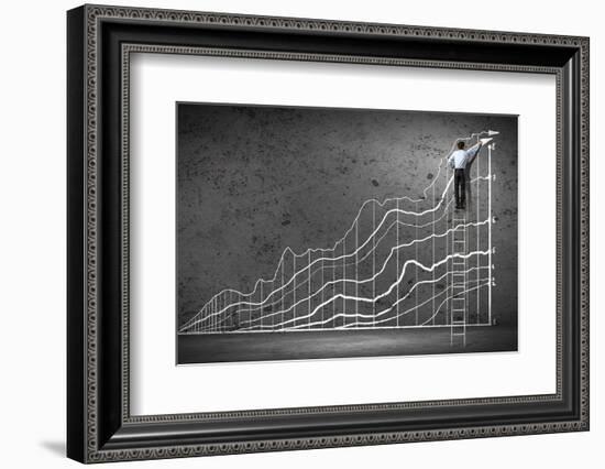 Businessman Drawing Graphics on Wall-Sergey Nivens-Framed Photographic Print