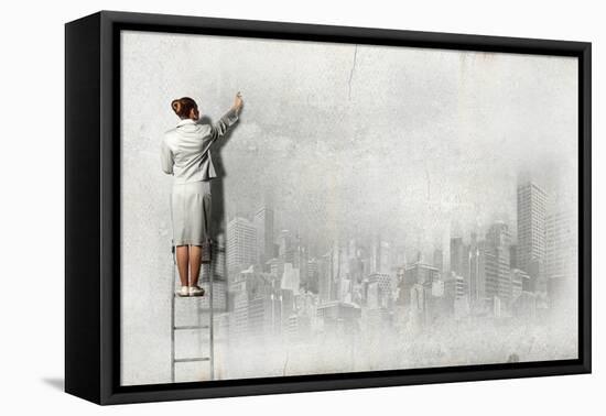 Businesswoman Standing on Ladder and Drawing Sketch on Wall-Sergey Nivens-Framed Premier Image Canvas